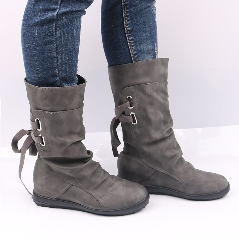 black flat tie up boots