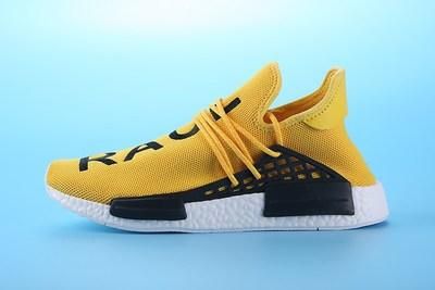 human race yellow trainers