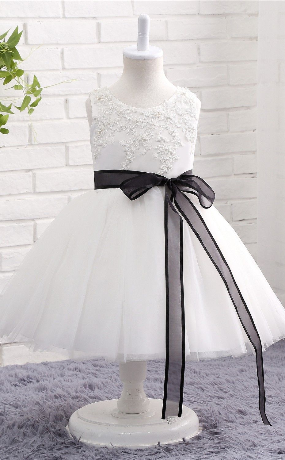white flower girl dress with black sash