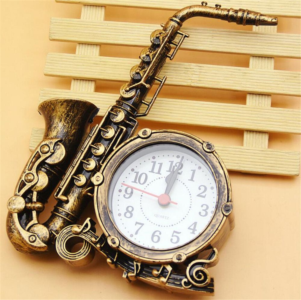 paquete Archivo doce Saxofón reloj despertador creativo instrumento musical forma niños relojes  sala de estar adornos de plástico regalo de navidad A2193c