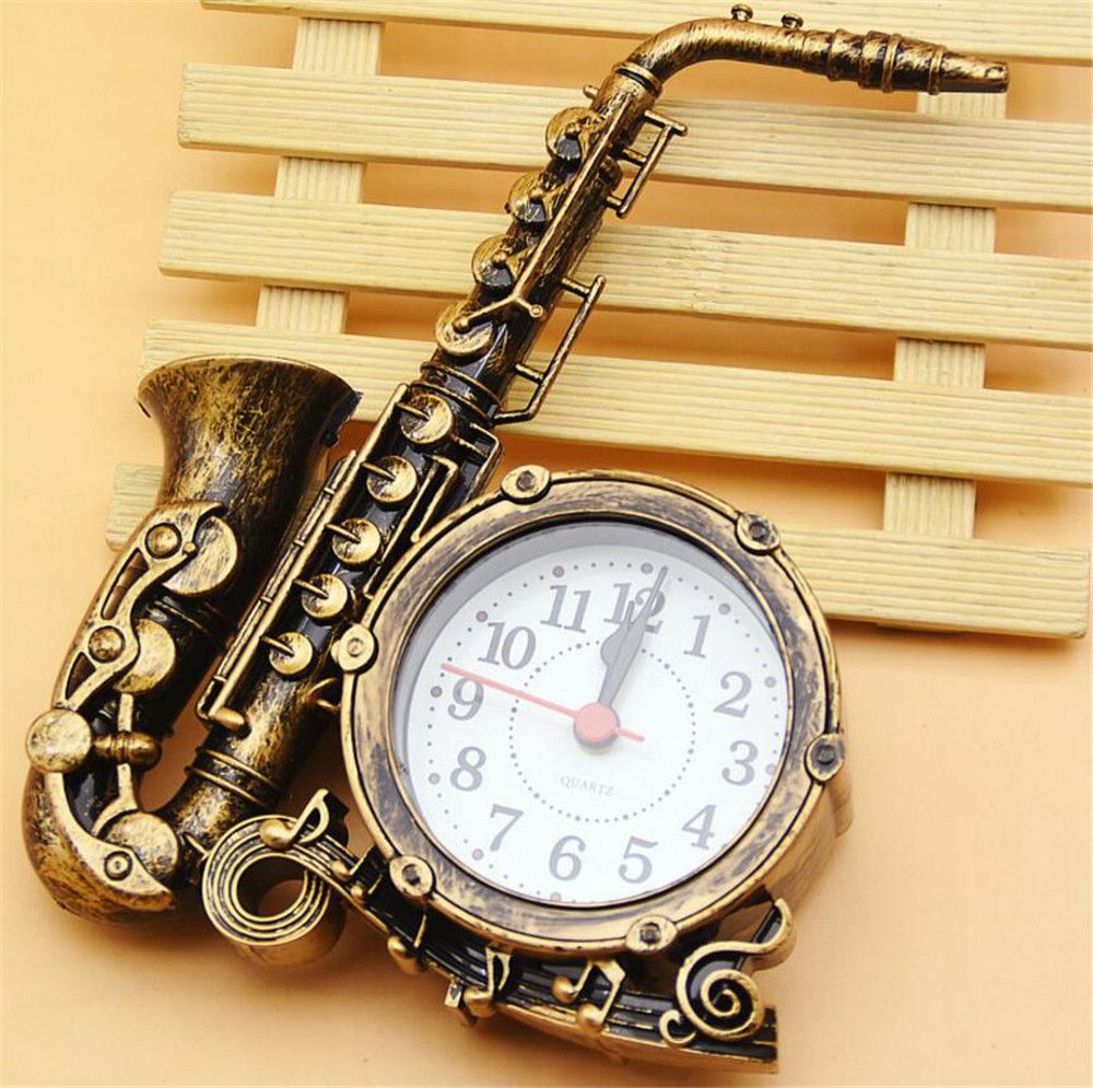 paquete Archivo doce Saxofón reloj despertador creativo instrumento musical forma niños relojes sala de estar adornos de plástico regalo de navidad A2193c paquete Archivo doce Saxofón reloj despertador creativo instrumento musical forma niños relojes sala de estar adornos de plástico regalo de navidad A2193c