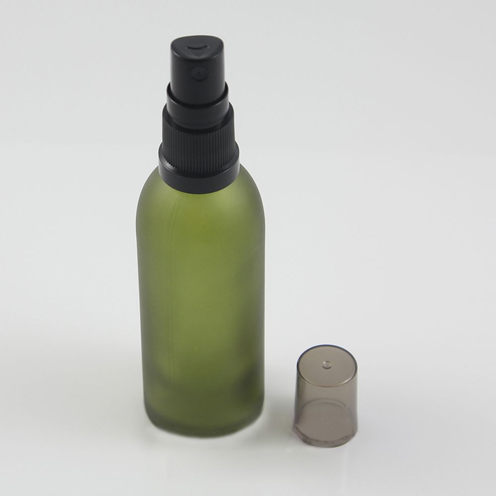 green glass spray bottle