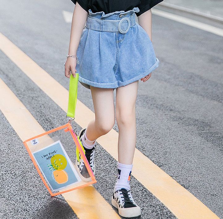 big girl wearing high waisted shorts