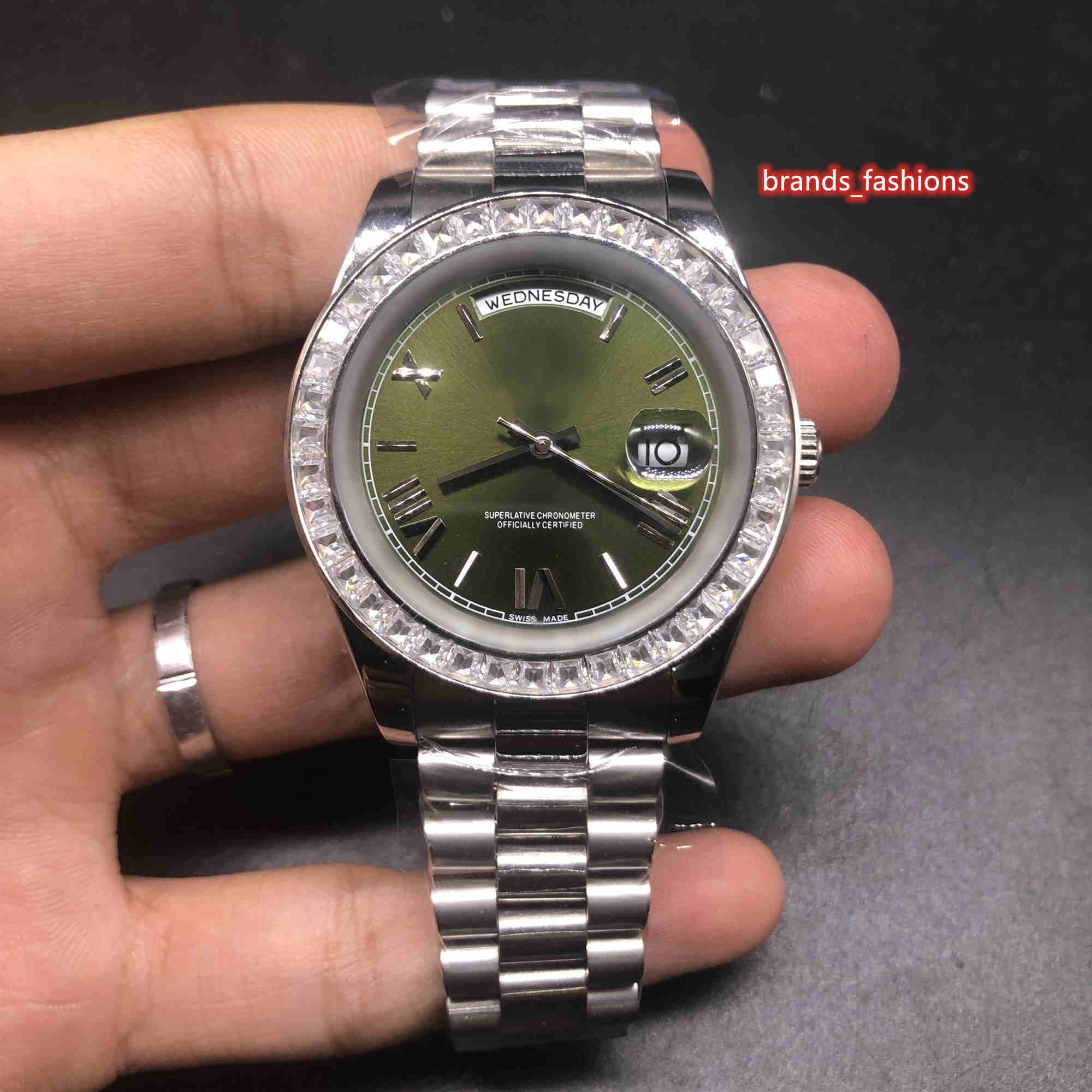 silver watch green face