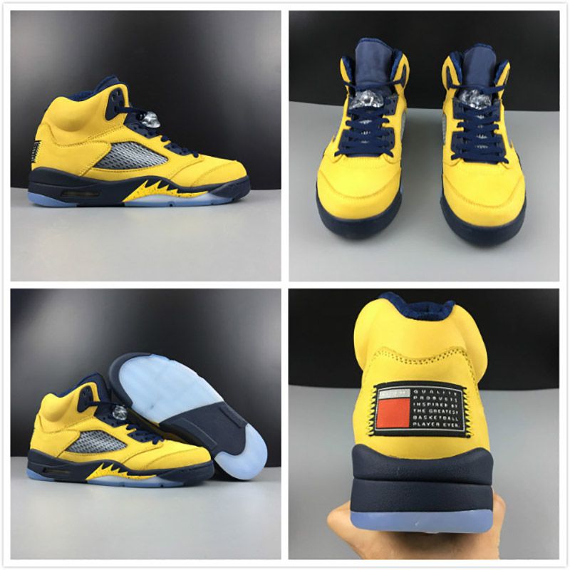 navy blue and yellow sneakers