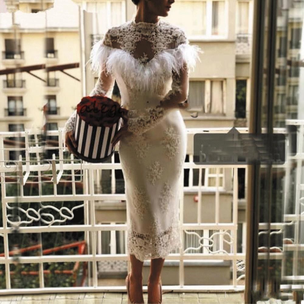 abiti eleganti con piume