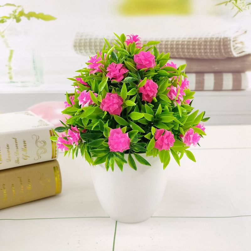small artificial flowers in vase