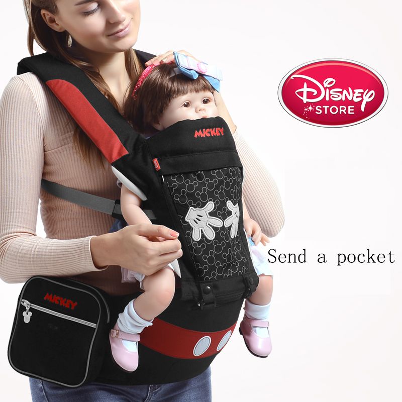 baby holding backpack