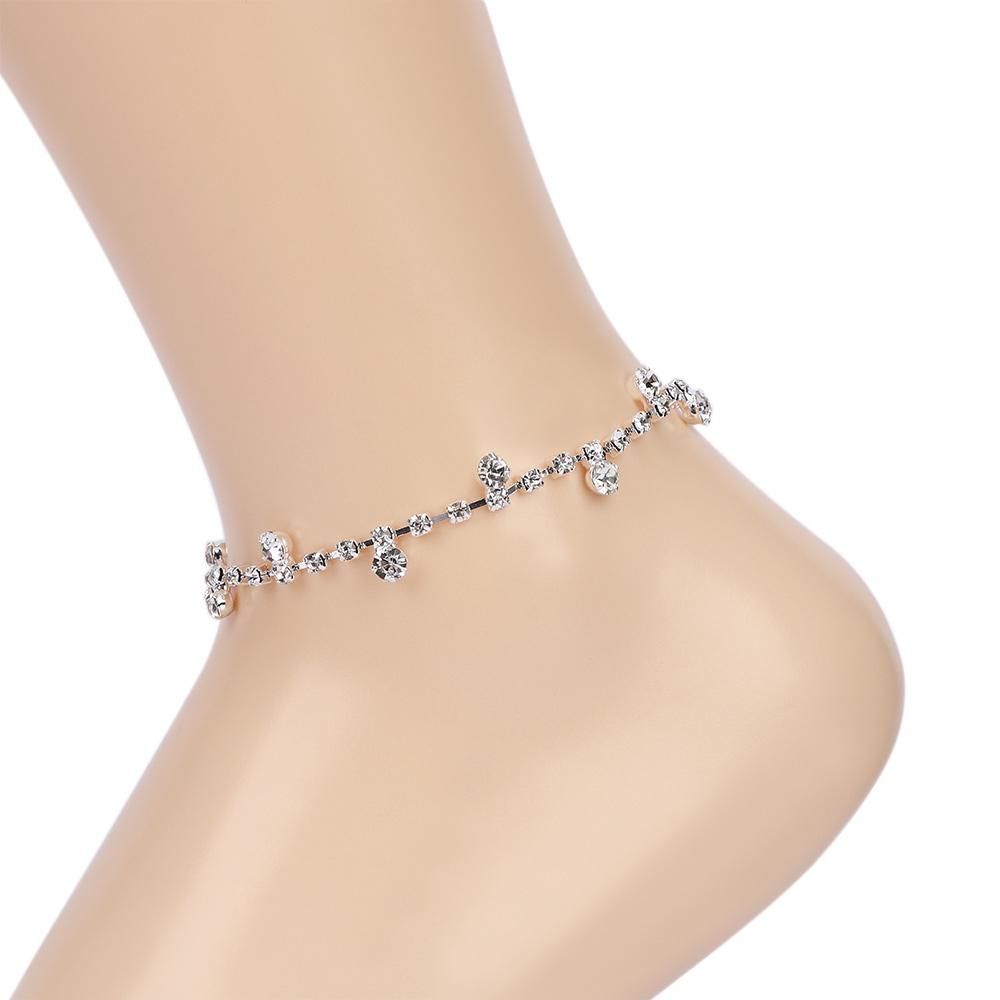 Silver Chain Anklet On The Leg Foot 