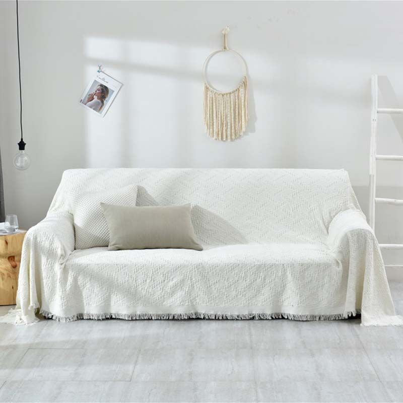 white sofa slipcovered