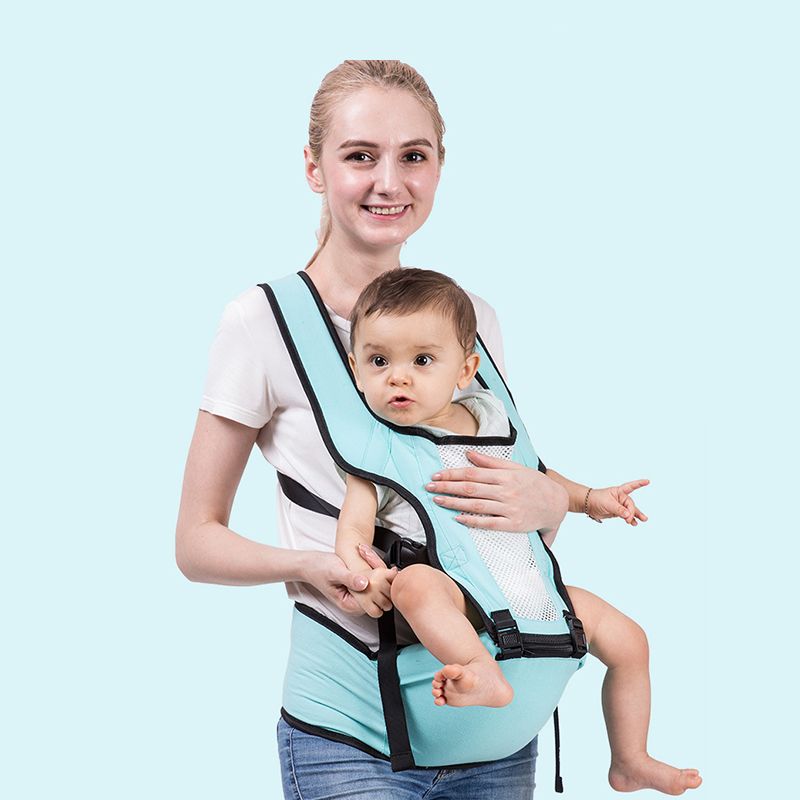 baby holding backpack