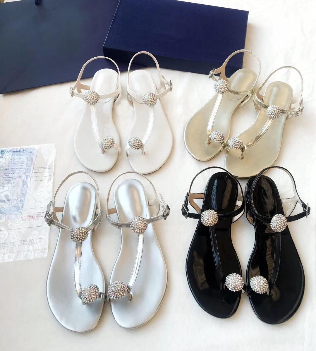 white and gold flip flops