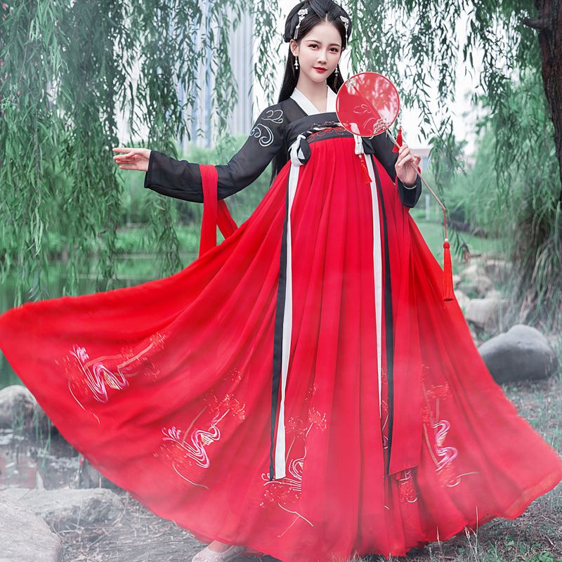 red skirt and black top