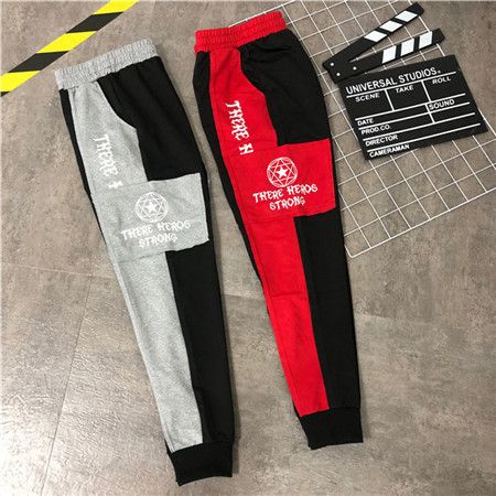 red and black tracksuit bottoms
