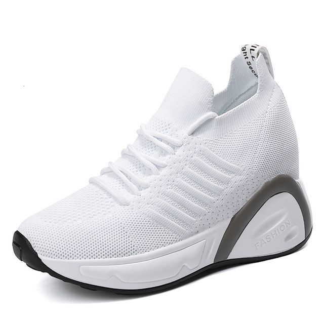 white sneakers with black heel