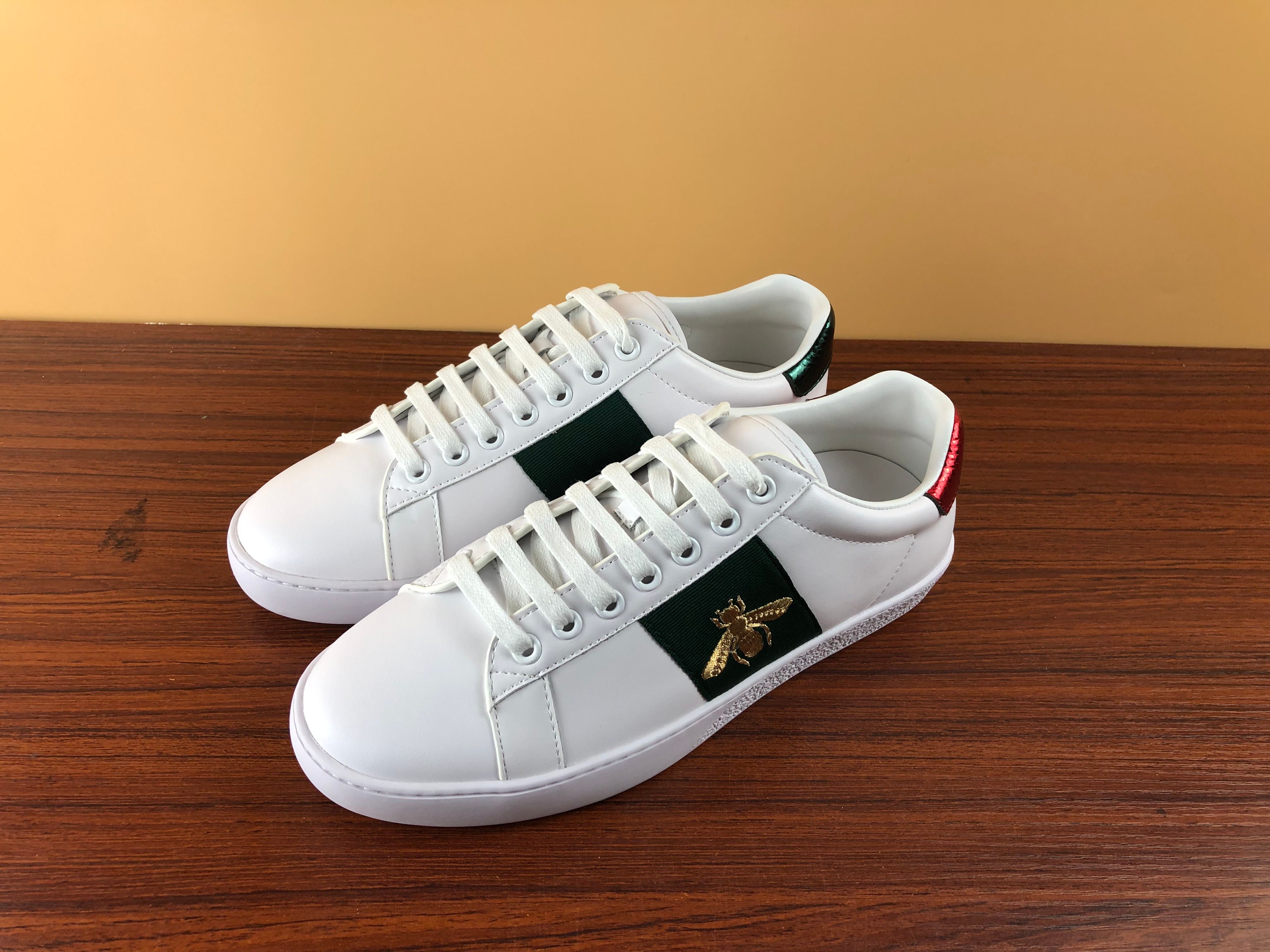 white sneakers with green and red stripe