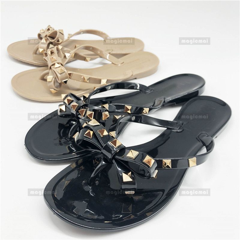 shiny black flip flops