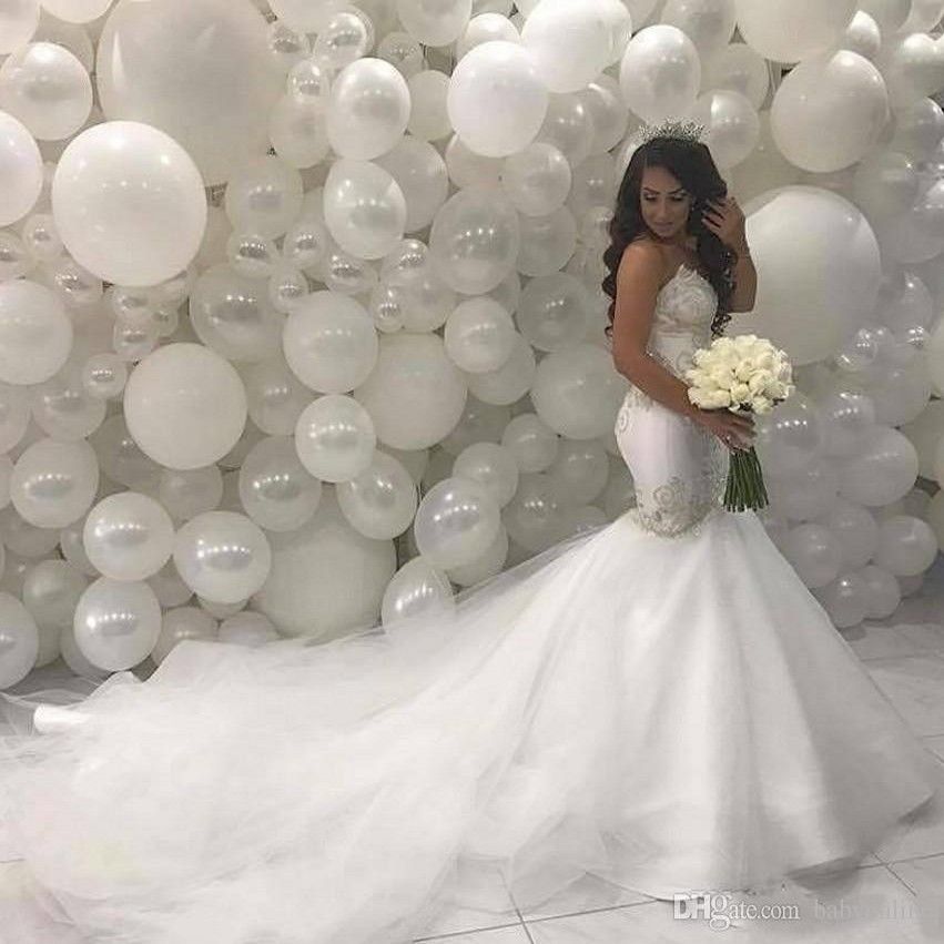 white wedding dress with gold trim