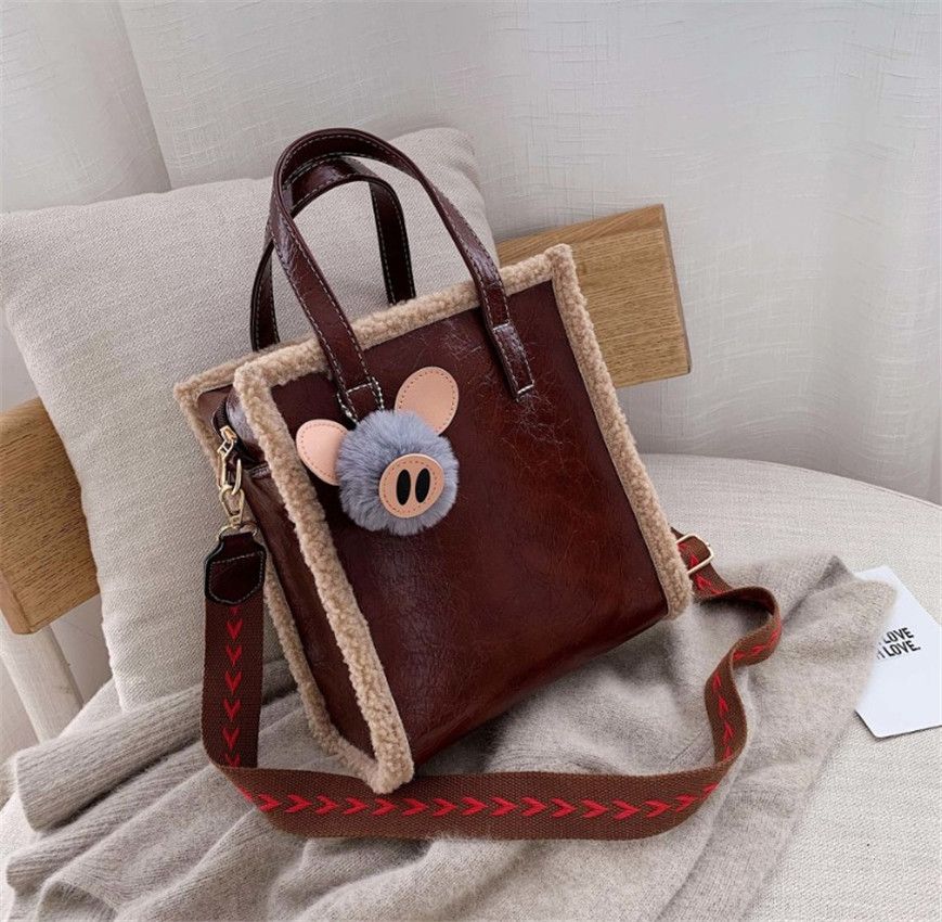 wide strap handbag