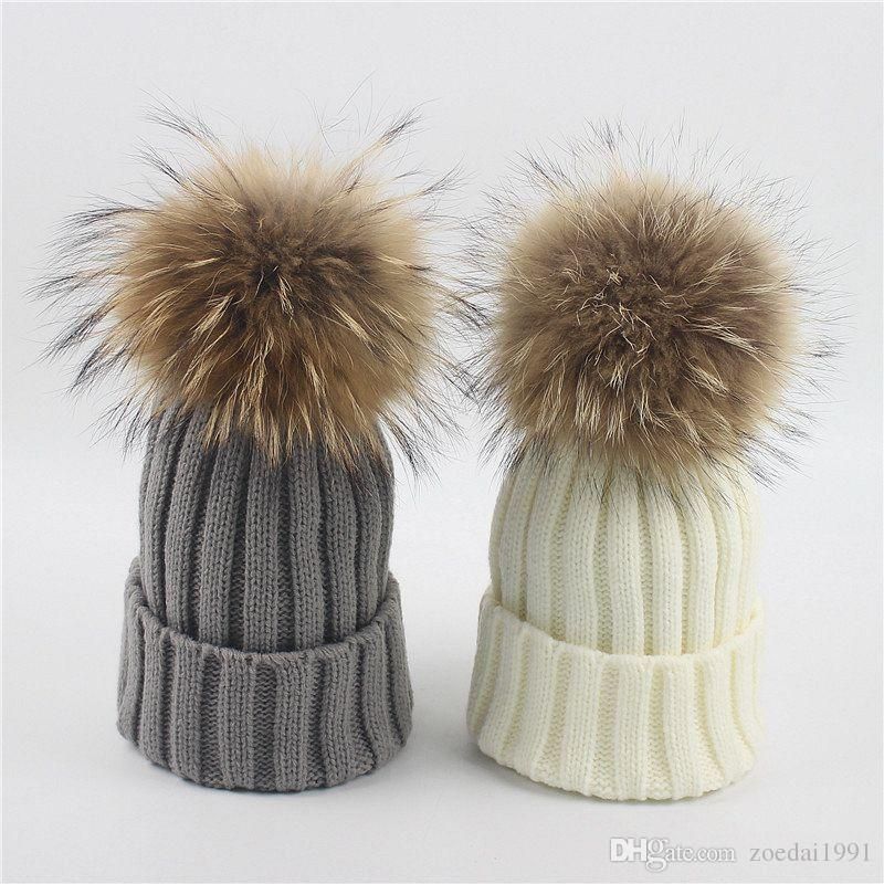 knit hat with fur ball on top