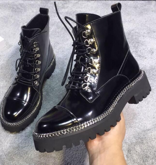 shiny black combat boots