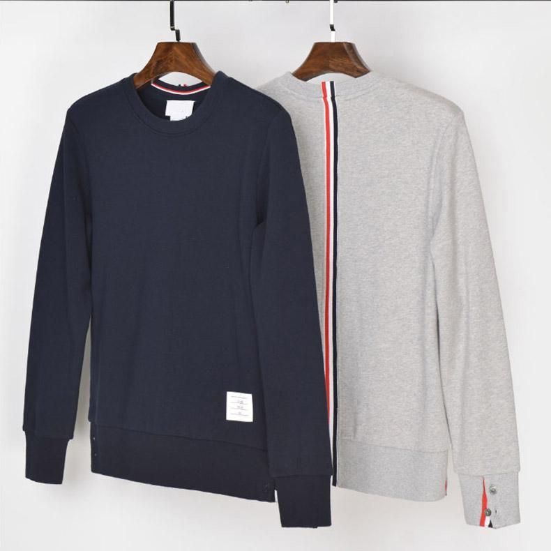 white sweatshirt with red and blue stripe