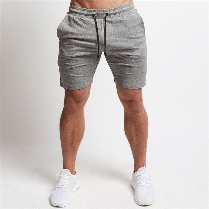Compra La Aptitud Para Hombre Pantalones Cortos Casual Color Sólido Con  Cordón Elástico De La Cintura Hasta La Rodilla Suelta Pantalones Cortos  Para Hombre Pantalones Cortos Para Correr Barato | Entrega Rápida