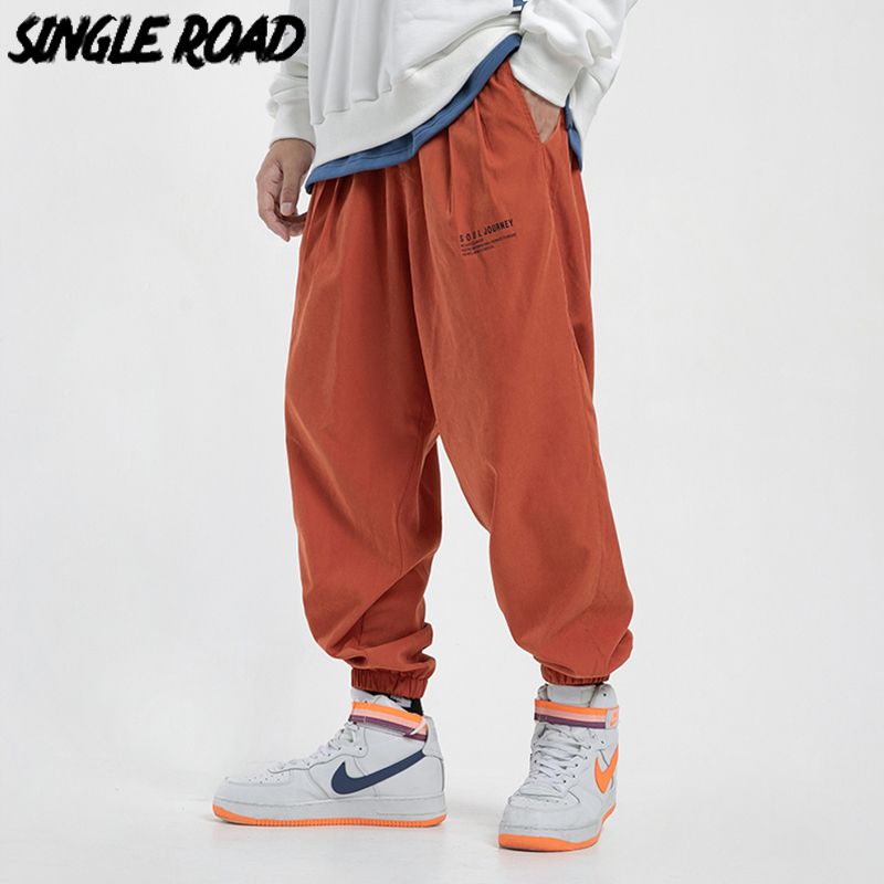men orange joggers