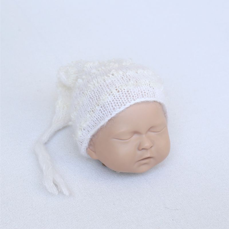 white knitted newborn hat
