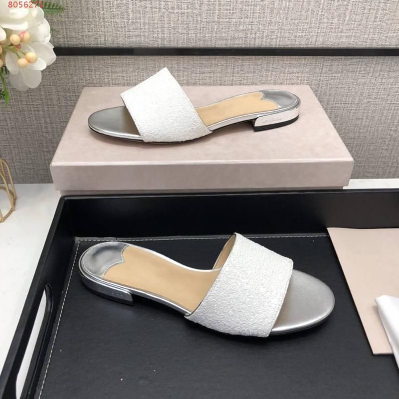 gold and white slippers