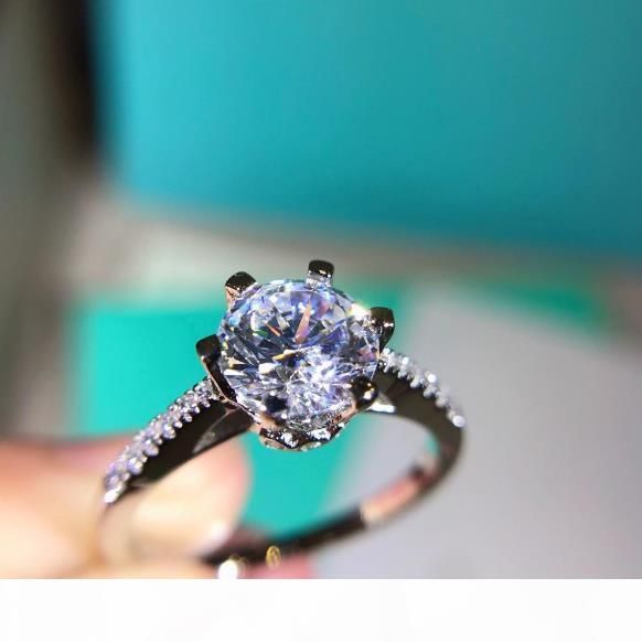 2020 One Cara Round Diamond Ring High Carbon Diamond Main Stone Small Diamond Embracing And Inlaying Six Small Gripper Inner Ring Hollow Art Bod From