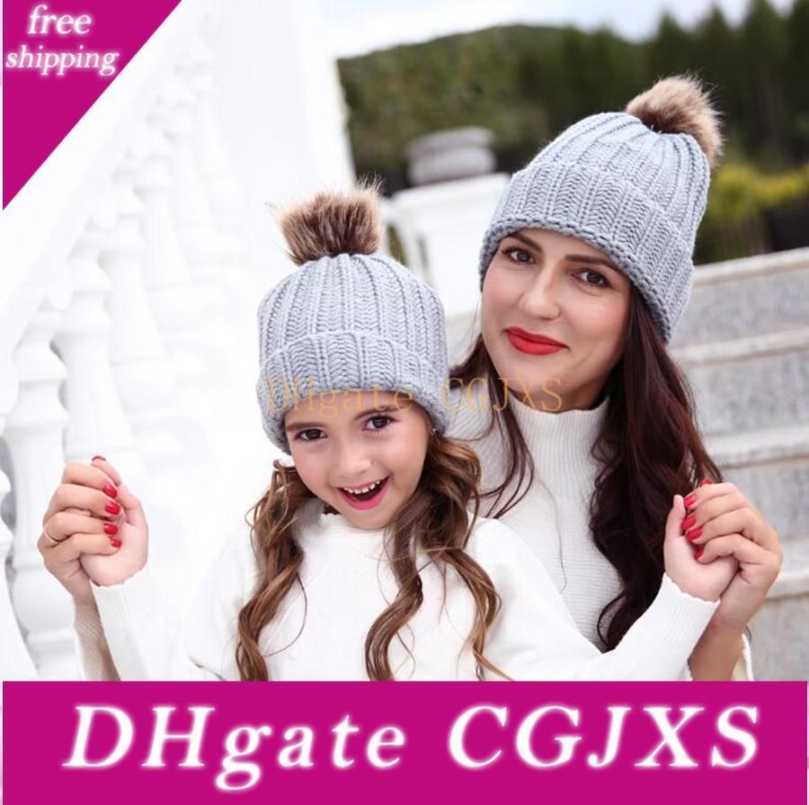 mother and baby matching bobble hats