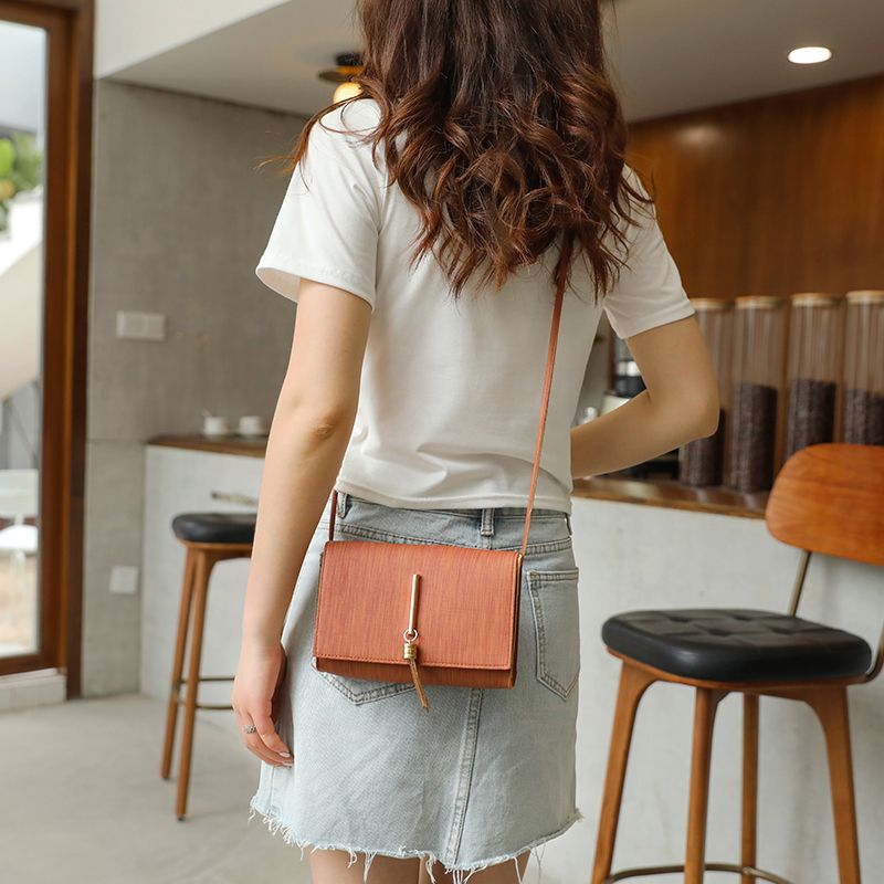 leather bolsa with tassels