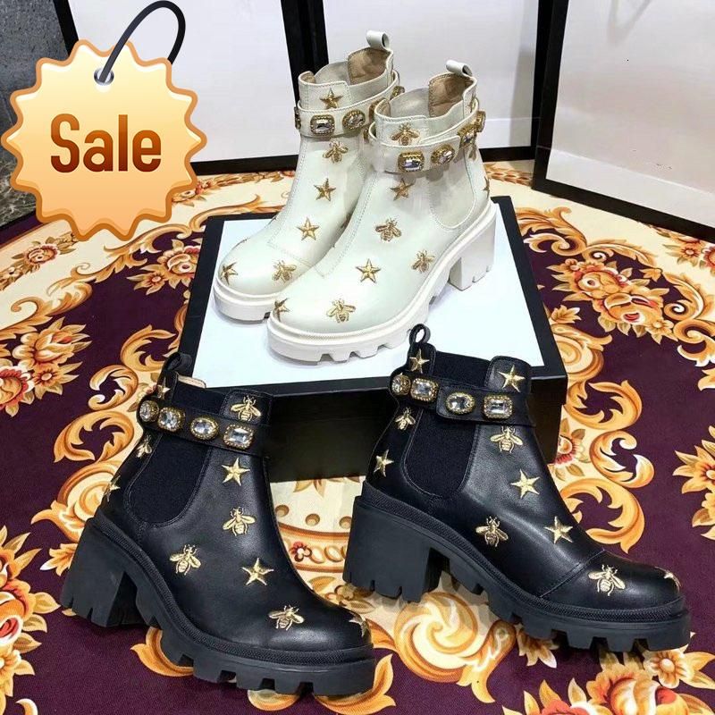 embroidered leather ankle boot with belt