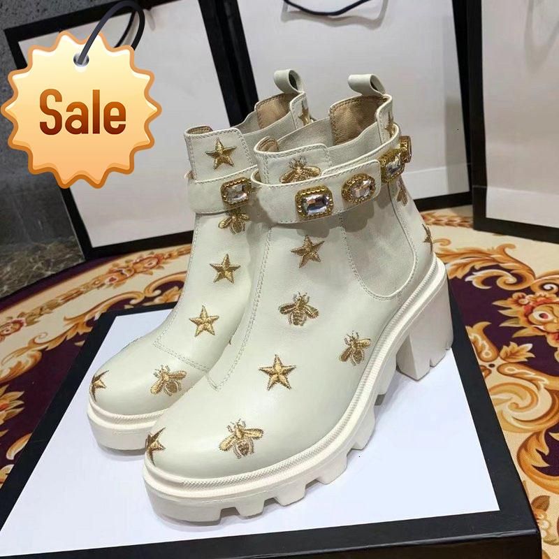 embroidered leather ankle boot with belt