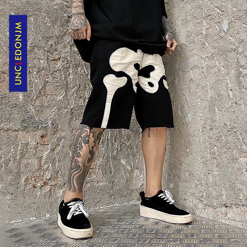 distressed black jean shorts