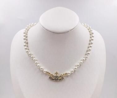 Golden Pearl Saturn Necklace