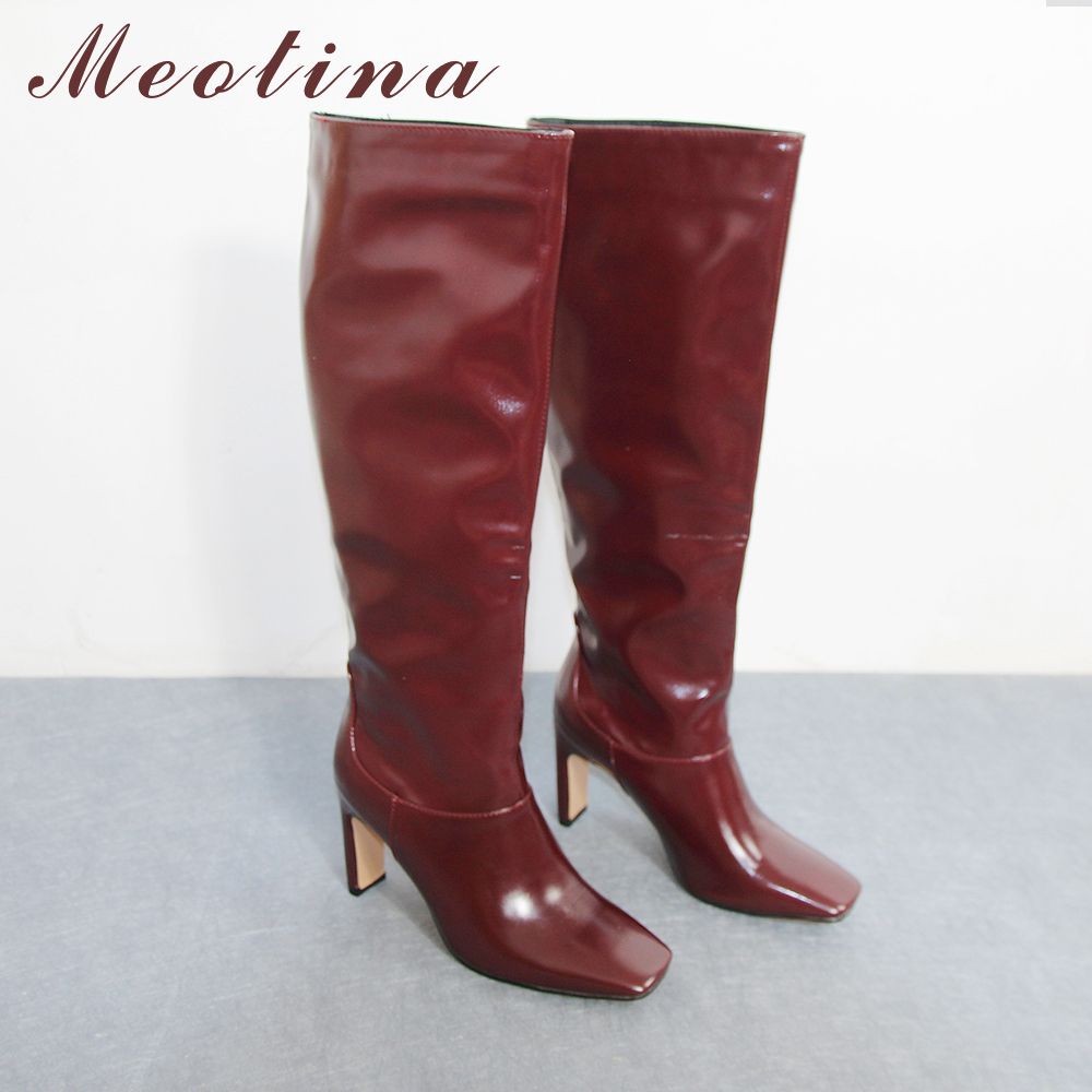 black heeled long boots