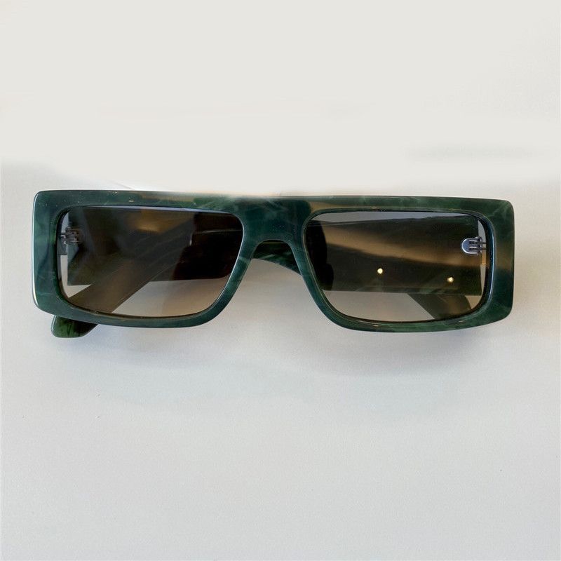 green frame light gray lenses