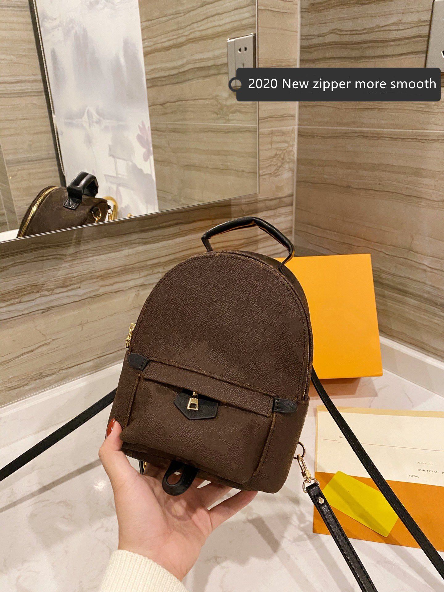 mini backpack with zipper on back