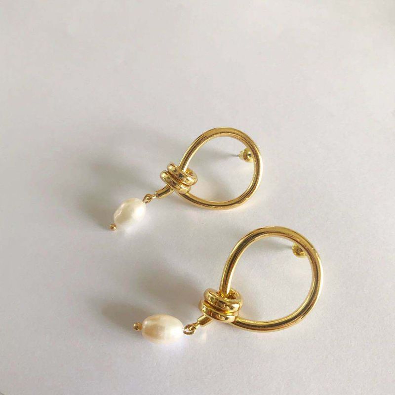 Double knot pearl earrings gold