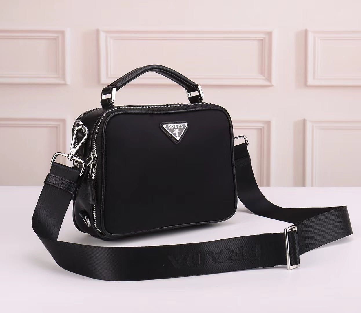 prada bolsas man