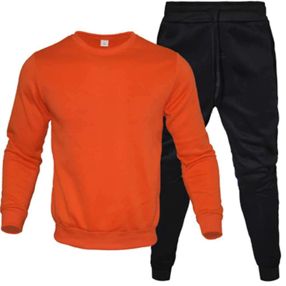Czarny obraz pomarańczowy płaszcz czarny spodni