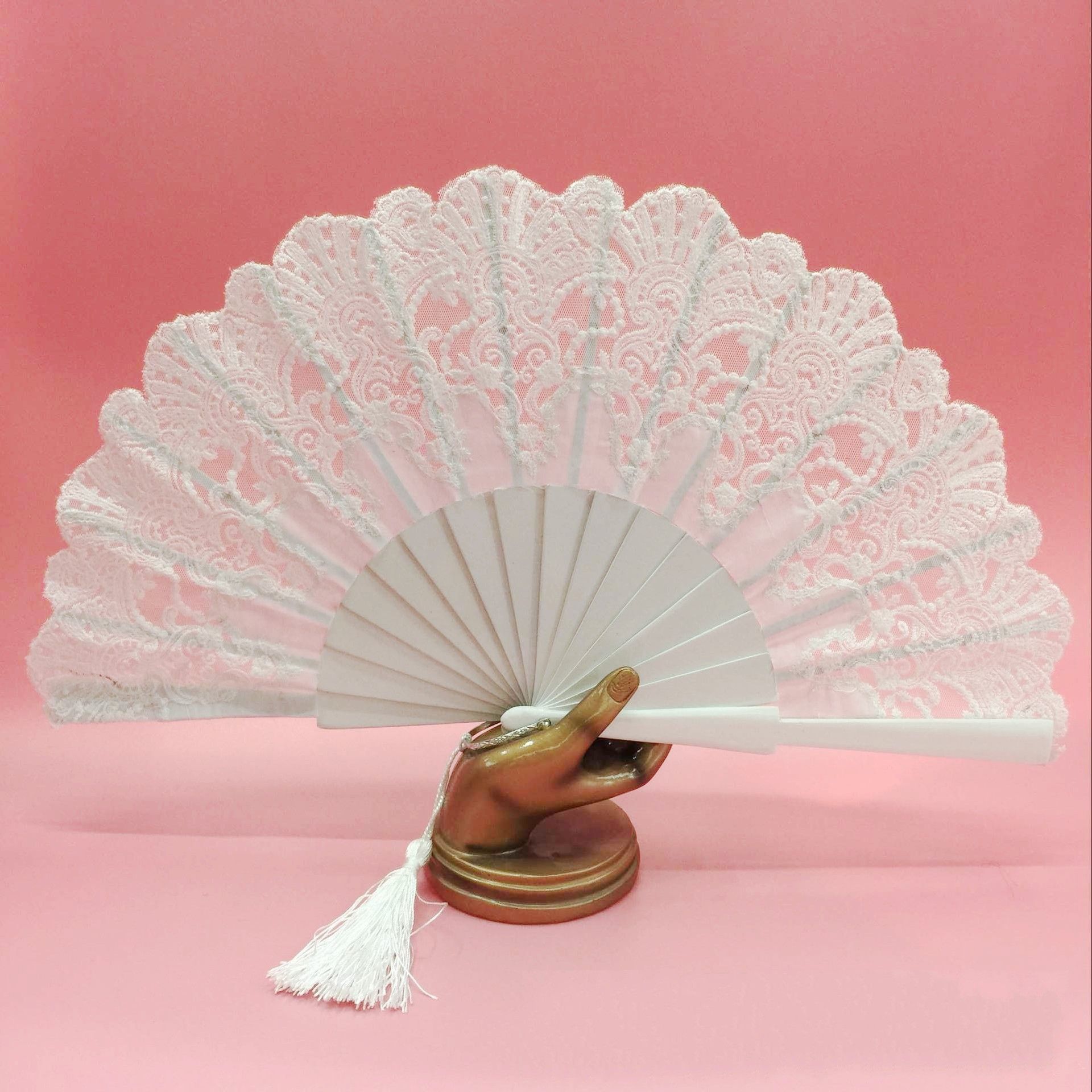 white hand fan