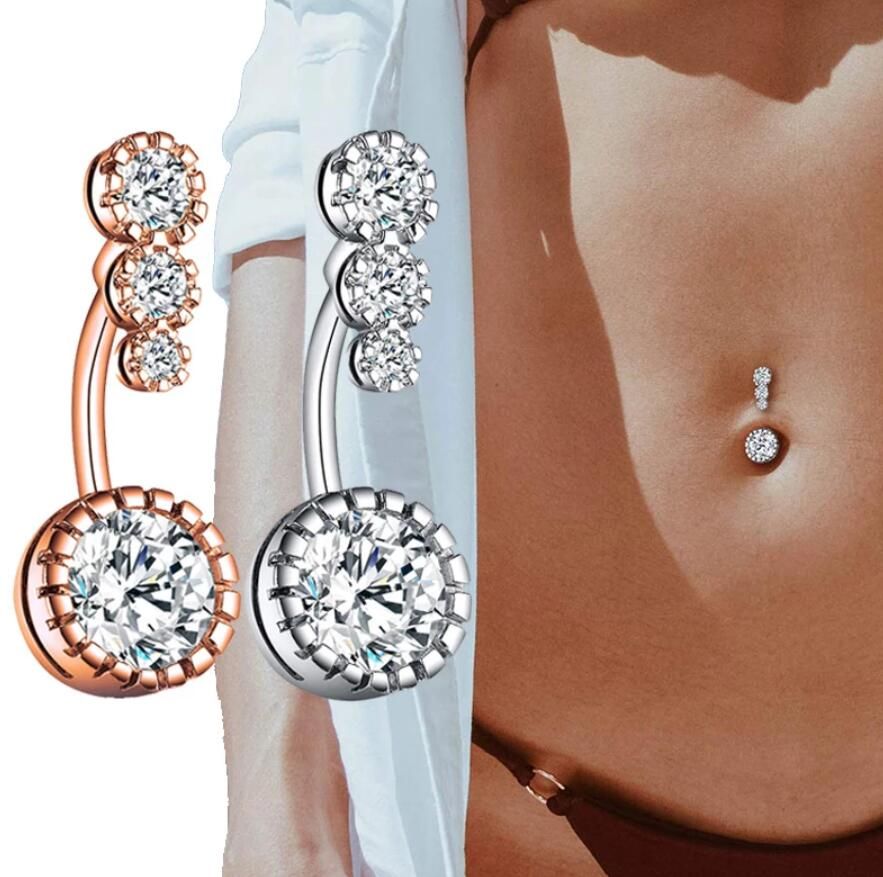 Steel belly button piercing – a cross adorned with tiny zircons, a round  zircon