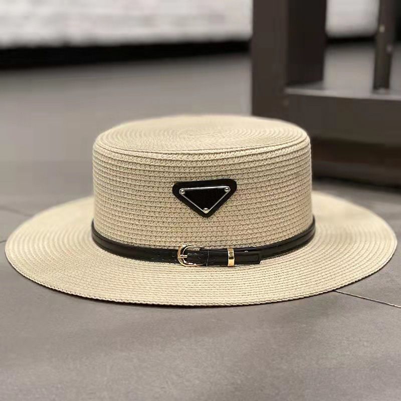 beige straw hat with black belt