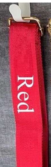 Red shoulder strap