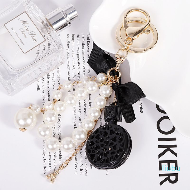 Luxury Designer Pearl Flower Perfume Bottle Womens Safety Keychain With  Diamond Rhinestone Cute And Fashionable Bag Charm From Serenaa1, $27.39