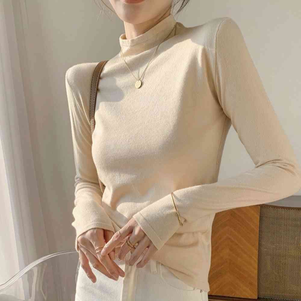 tight white sweater