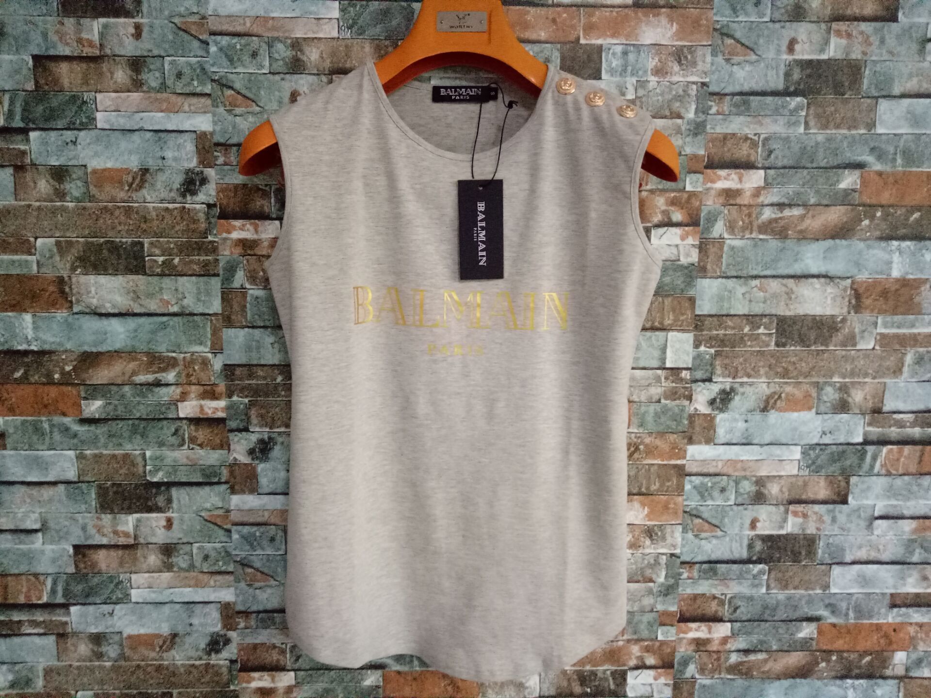 Gray gold letter and button